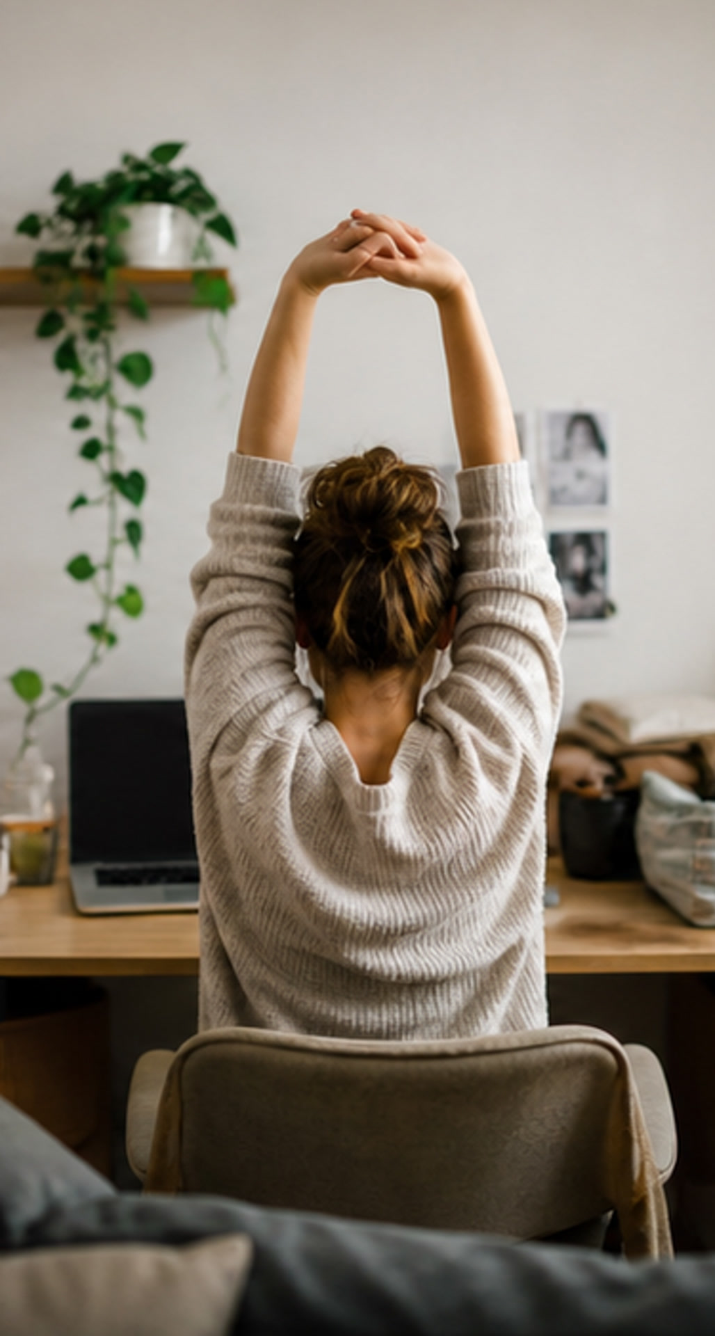 Person stretching at a desk during a short screen break